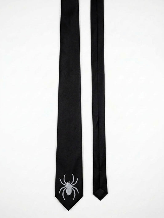 A black necktie with a white spider graphic printed on the tip, displayed next to its matching black ribbon end on a plain white background.