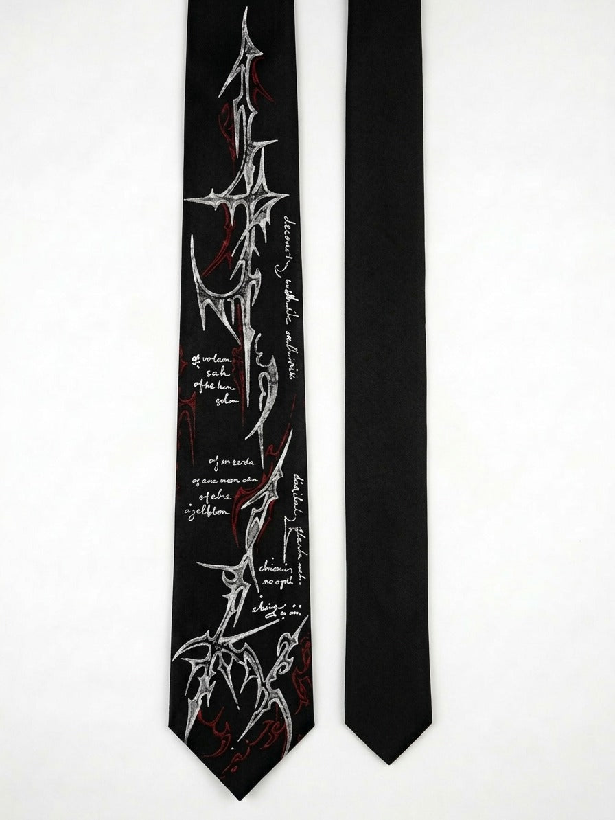 A black necktie with a highly detailed graphic print of the Morbid Angel band logo and handwritten-style text, shown alongside a second solid black necktie on a plain white background.